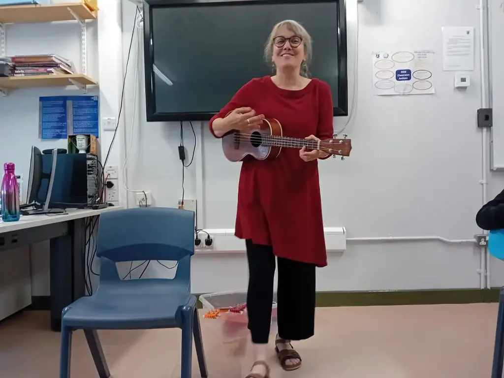 Guitar instructor teaching a class