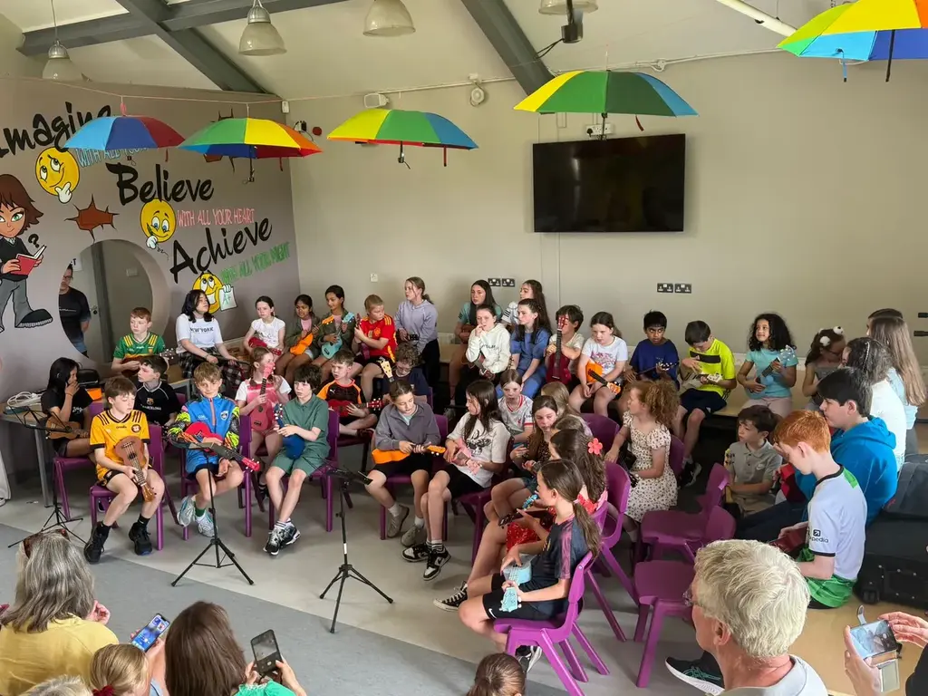 Large group ensemble performing indoors