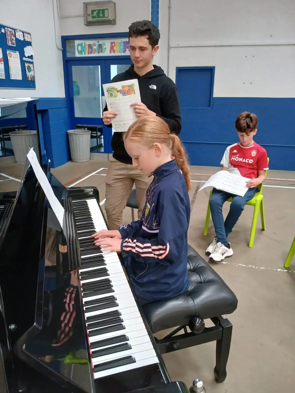 Student performing during piano lesson